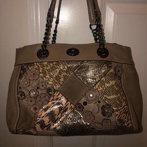 Lightly used animal print and flower coach bag